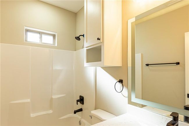 Full bathroom with shower / bathtub combination, vanity, and toilet | Image 16