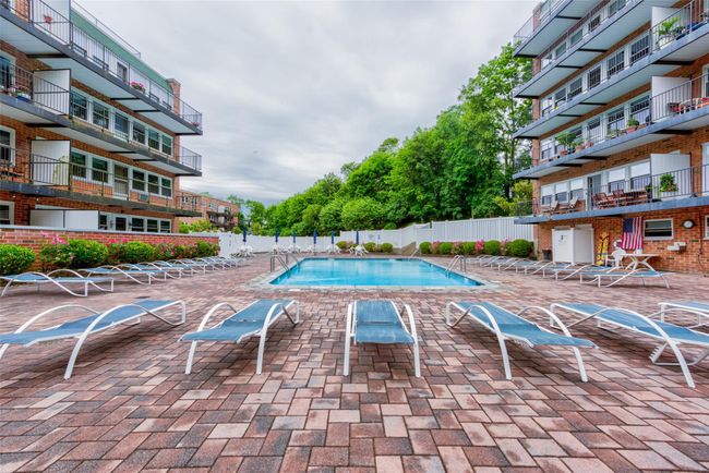 Community pool featuring a patio area and fence | Image 27