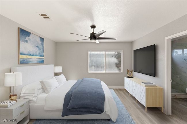 Bedroom with light wood finished floors, baseboards, ceiling fan, and multiple windows | Image 25