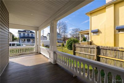 Wooden terrace featuring covered porch | Image 1