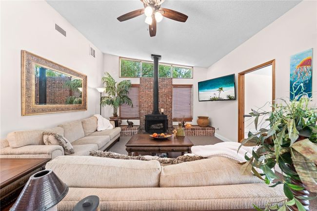 Main Home - Enjoy this cozy Family Room with a wood burning fireplace. | Image 35