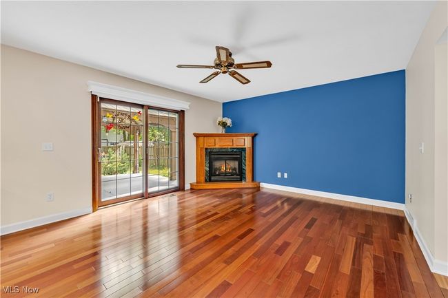 FAMILY ROOM WITH CUSTOM BRAZILIAN DURABLE FLOORING - COUNTER GAS FIREPLACE - PATIO ACCESS TO OUTSIDE DECK AND NATURE VIEWS | Image 8
