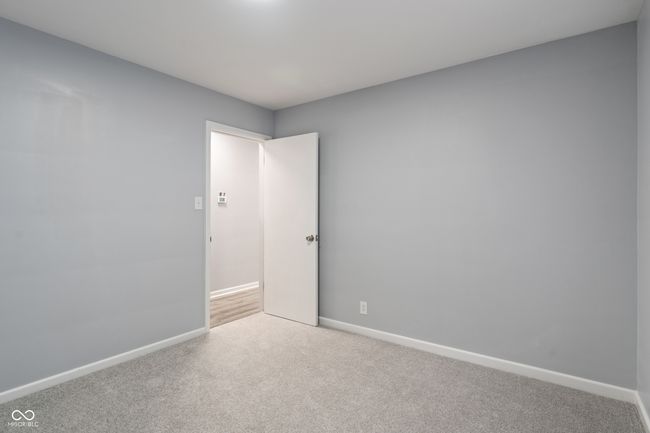 unfurnished room with carpet floors and baseboards | Image 27