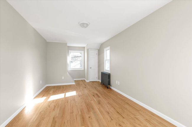 Spare room with radiator and light wood-type flooring | Image 8