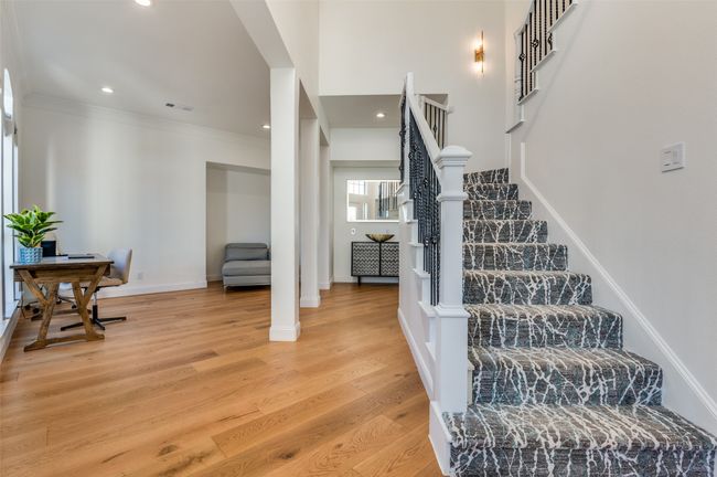 Stairway with visible vents, crown molding, baseboards, wood finished floors, and recessed lighting | Image 17