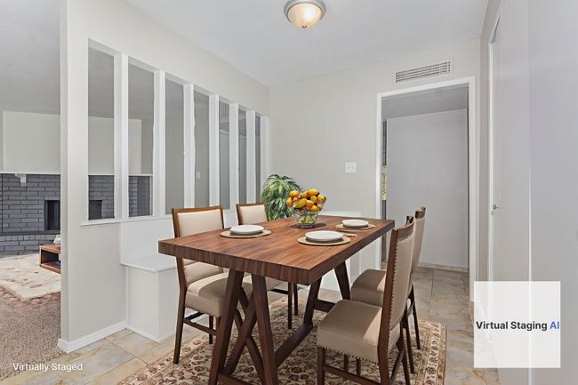 virtually enhanced-Dining space with baseboards and a brick fireplace | Image 12