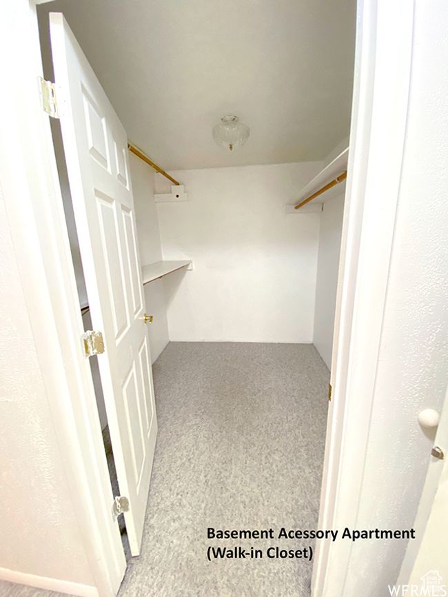 Spacious closet featuring carpet floors | Image 14