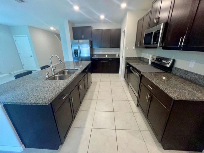 9520 Lemon Drop Loop, House other with 6 bedrooms, 3 bathrooms and null parking in SUN CITY CENTER FL | Image 4