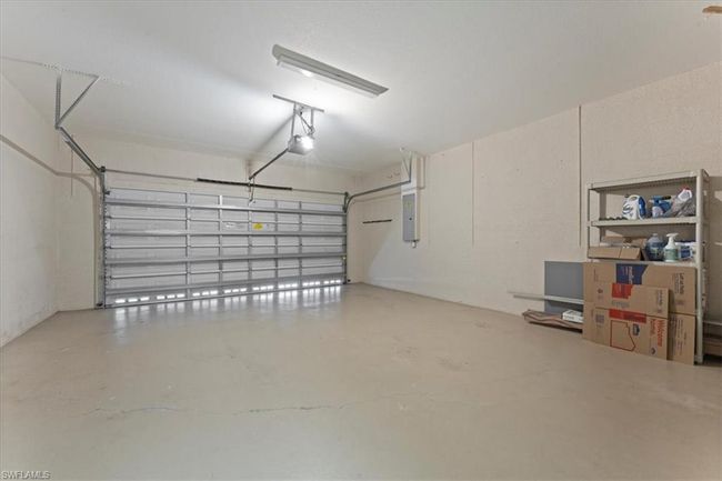 Garage with electric panel and a garage door opener | Image 33