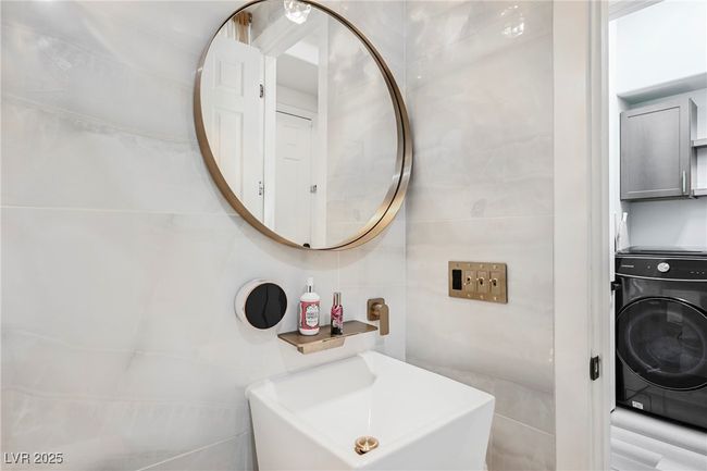 Downstairs 3/4 Bathroom with a sink, tile walls | Image 28
