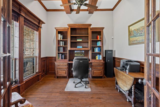 Office featuring a ceiling fan, crown molding, a wainscoted wall, and coffered ceiling | Image 15
