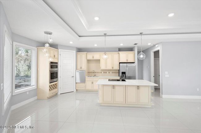 kitchen with breakfast nook | Image 11