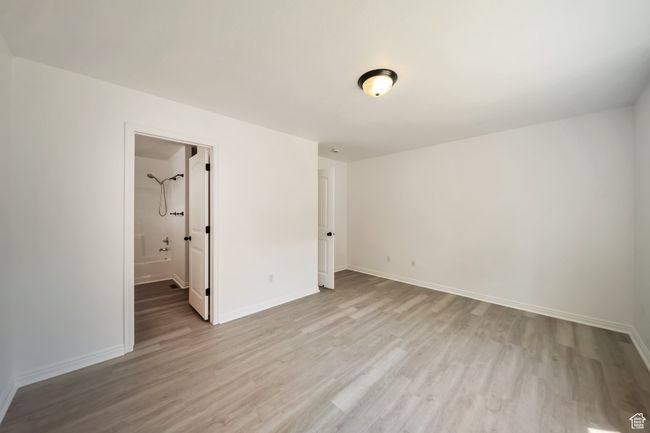 Primary Bedroom with bathroom & walk-in-closet | Image 14