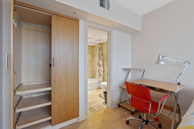 Pullout shelving in the closet and its own ensuite bath. | Image 21