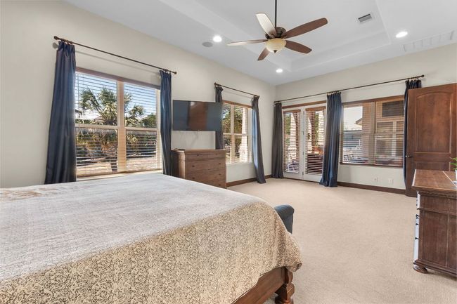 Primary bedroom featuring light colored carpet, recessed lighting, and a ceiling fan | Image 14