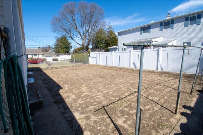 View of yard with a fenced backyard | Image 25