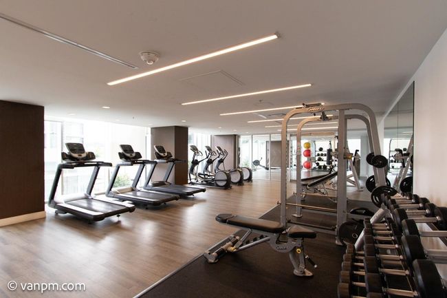 Workout area with expansive windows and wood finished floors | Image 17
