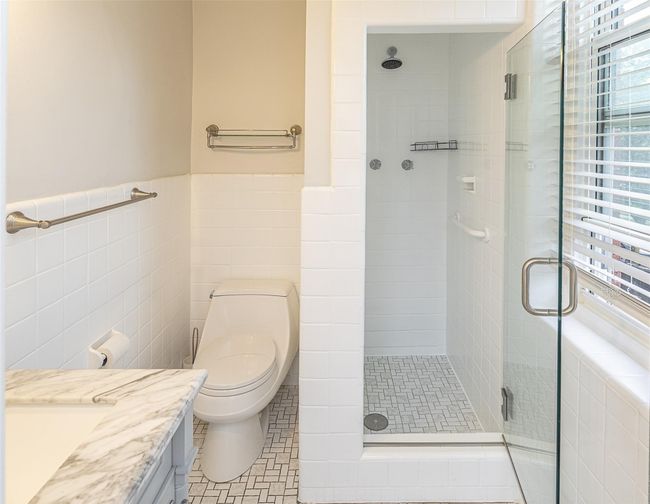 The primary bathroom includes walk in shower | Image 14