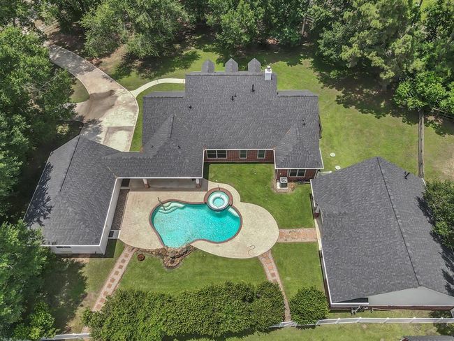 Aerial close up of the Garage (left), main house and Pool (middle) and the Secondary House (right). | Image 49