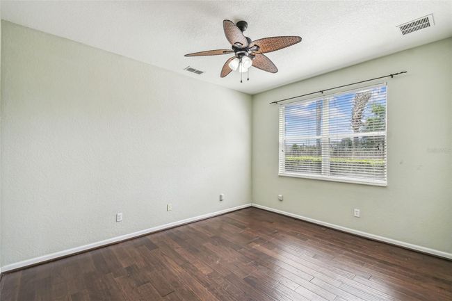Downstairs bedroom includes a private en-suite bathroom with a walk-in closet and a walk-in shower. | Image 12