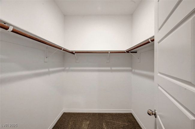 Walk in closet with carpet floors | Image 37