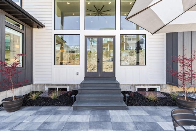 View of exterior entry featuring board and batten siding and french doors | Image 71