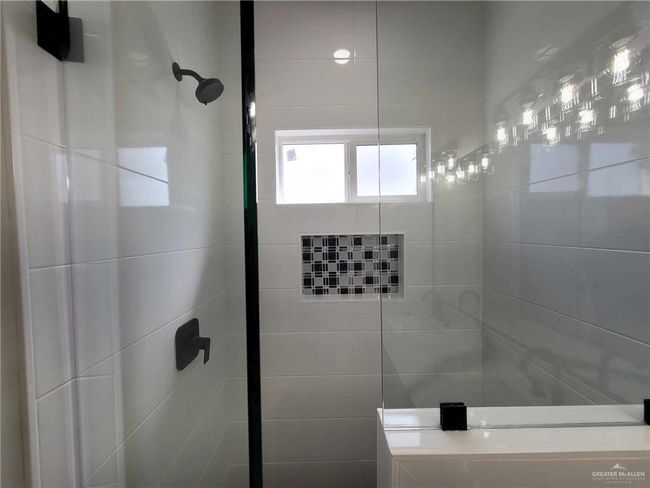 Bathroom with a tile shower | Image 20