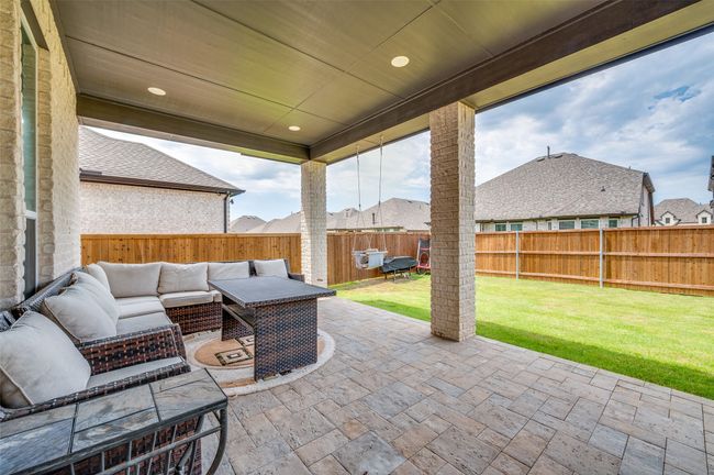 Fenced backyard with a patio area and an outdoor living space | Image 21