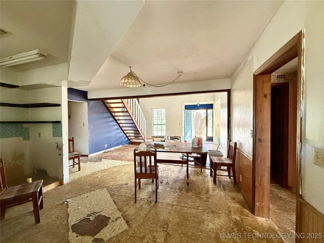 FROM THE BACK DOOR OR ENTRANCE TO THE BONUS ROOM IN THE KITCHEN LOOKING TO THE FRONT DOOR AND LIVING AREA | Image 11