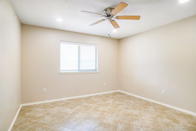 Unfurnished room featuring a ceiling fan, recessed lighting, baseboards, and light tile patterned floors | Image 8