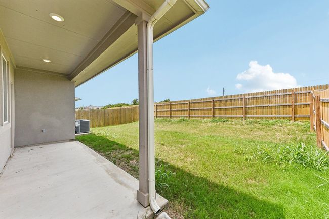 True Backyard Privacy: Backing to protected greenbelt, this fully fenced yard offers peace and space. | Image 10