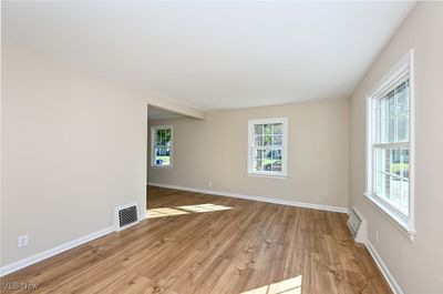 Living room featuring light hardwood / wood-style flooring | Image 2