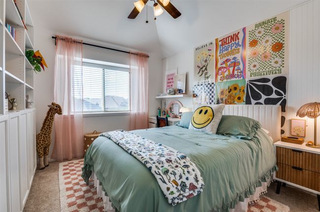 Airy and bright upstairs bedroom has a feature wall and access to a full bath! | Image 17