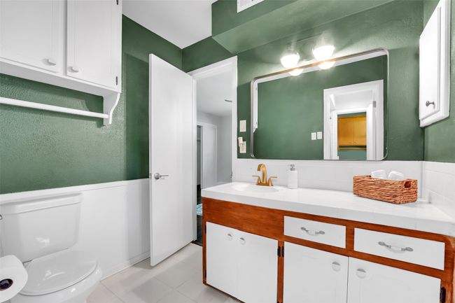 Bathroom featuring vanity and a wainscoted wall | Image 15