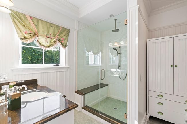 Carpeted bedroom with a closet, crown molding, and a notable chandelier | Image 22