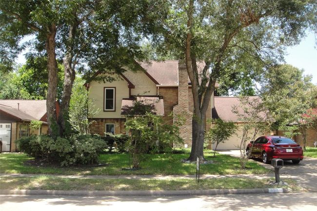 Large trees in front and back for cool shade. | Image 10