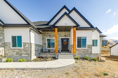 View of front facade featuring a porch | Image 1