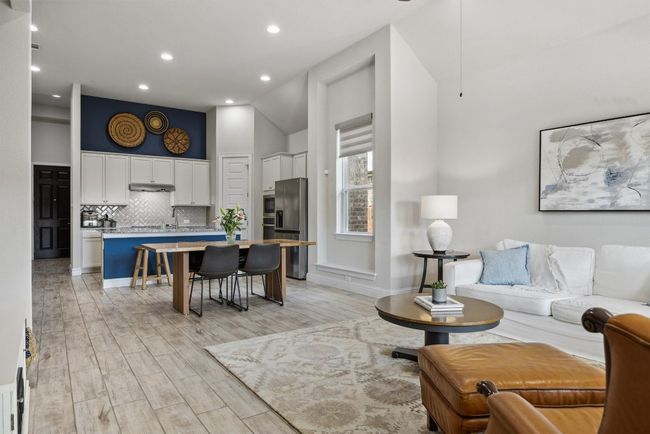 Living area featuring recessed lighting, high vaulted ceiling, and light wood-type flooring | Image 11
