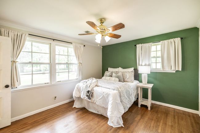 Moving to the other end of the home, you'll find the primary suite tucked away. | Image 50