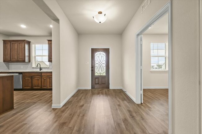 Foyer featuring light wood-type flooring and recessed lighting | Image 6