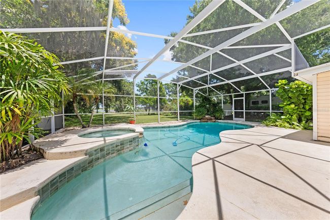 Heated Pool and Spa overlooking the backyard and Fish Lake | Image 4