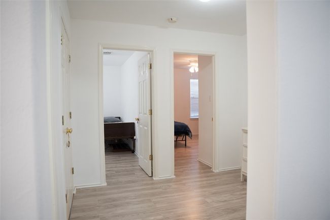 Hall featuring light wood-style flooring and baseboards | Image 9