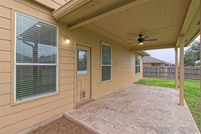 View of patio with ceiling fan | Image 33