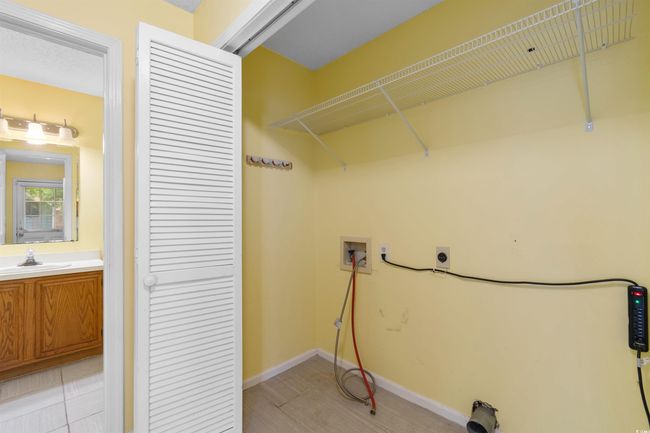 Laundry room featuring washer hookup and electric dryer hookup | Image 26