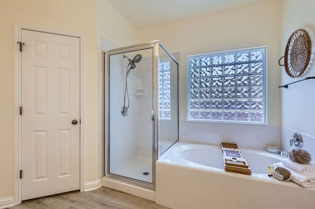 Relaxing primary bathroom with walk-in shower, and garden tub. | Image 17