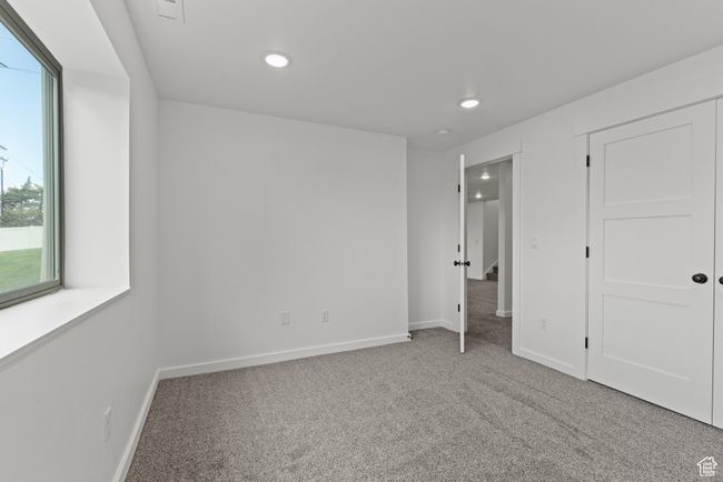 Unfurnished bedroom with carpet flooring, recessed lighting, and baseboards | Image 33