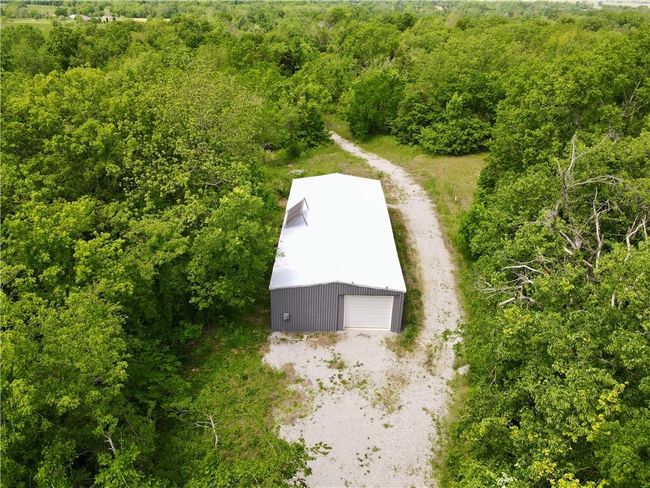 View of subject property with a heavily wooded area | Image 16