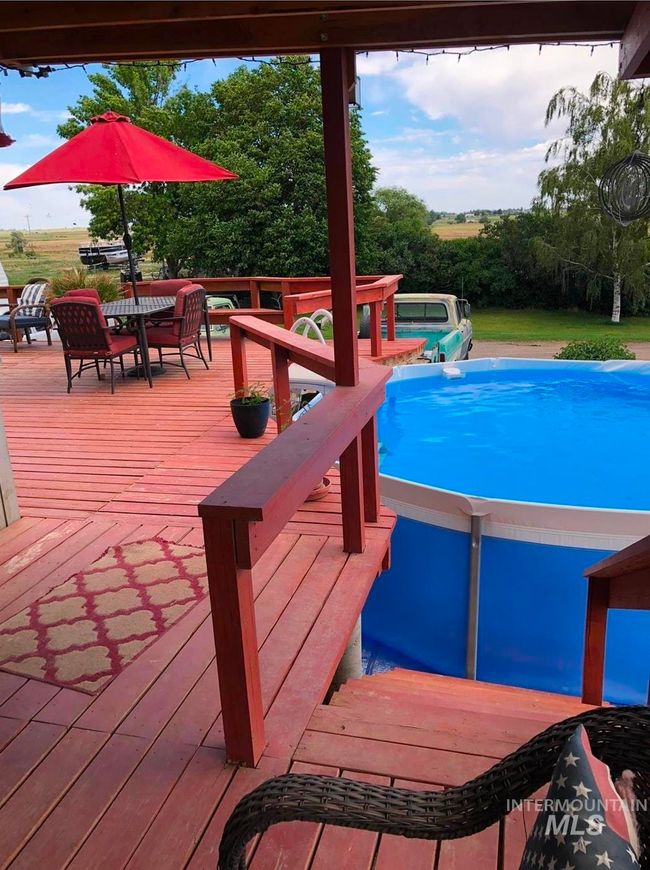 Swimming pool with a wooden deck | Image 7