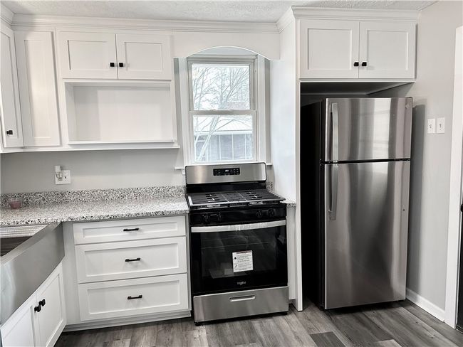 Kitchen with SS appliances | Image 6