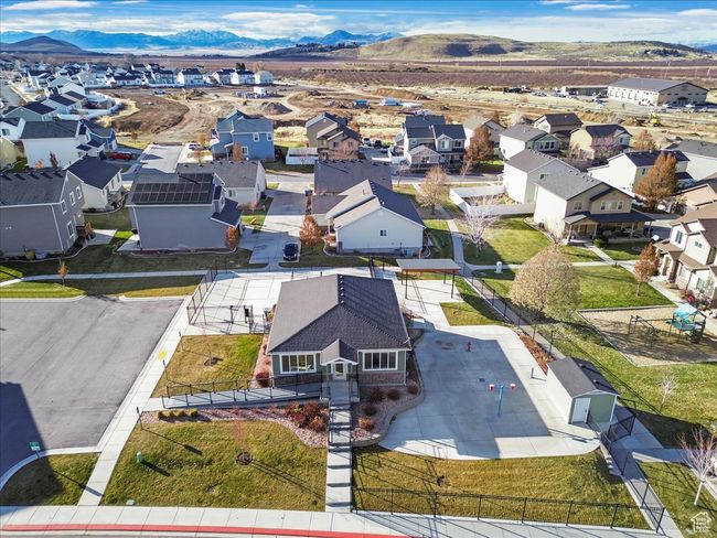 Aerial view of residential area featuring a mountainous background | Image 39